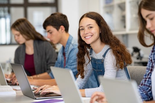 students using laptops at desk K-12 chromebook management